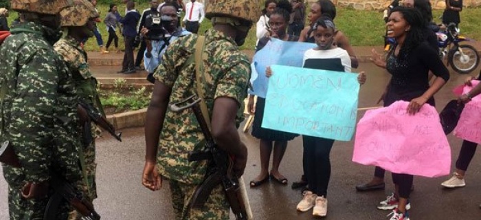 Soldiers confront students protesting tuition increment at Makerere University on October 22, 219. Photo by Alex Esagala 